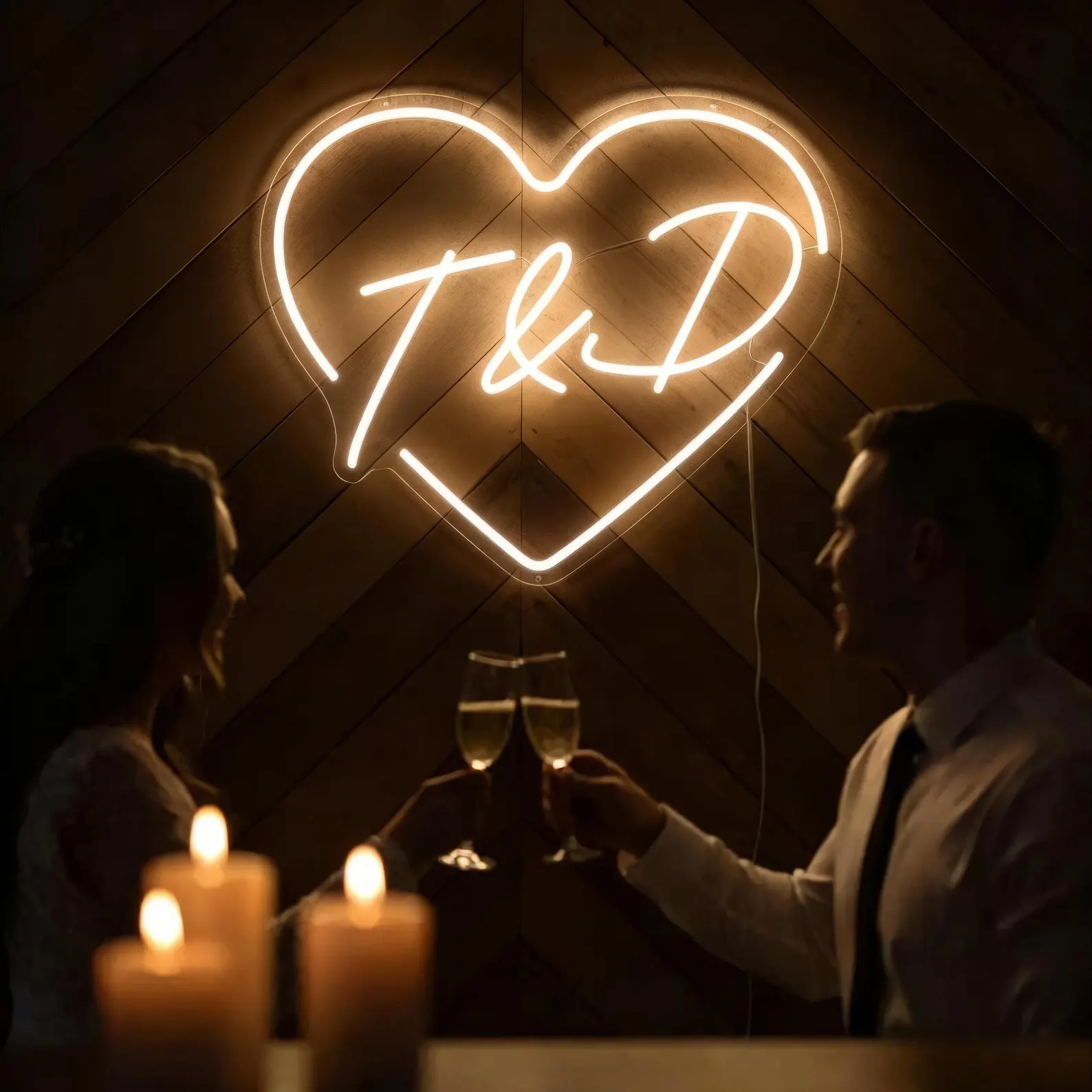 Custom wedding neon sign lighting up a couple's special day Couple celebrating under a custom wedding neon sign at their UK reception